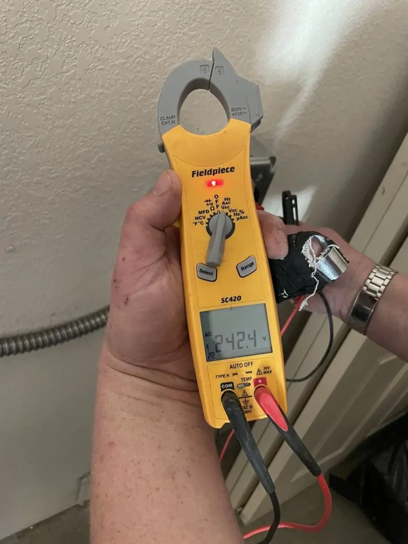 Voltage testing with clamp meter during Generator Installation in West Hollywood